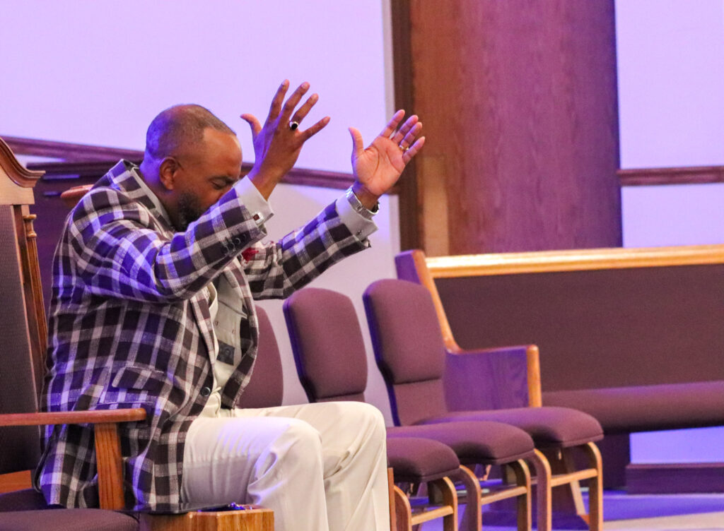 image of pastor praying